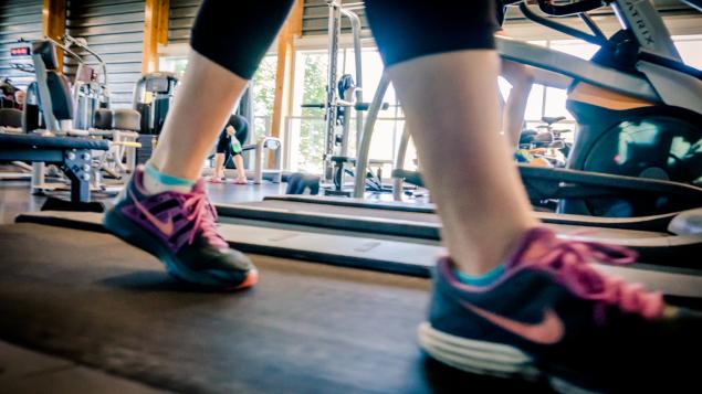 close up view of feet and ankles of a person on treadmill