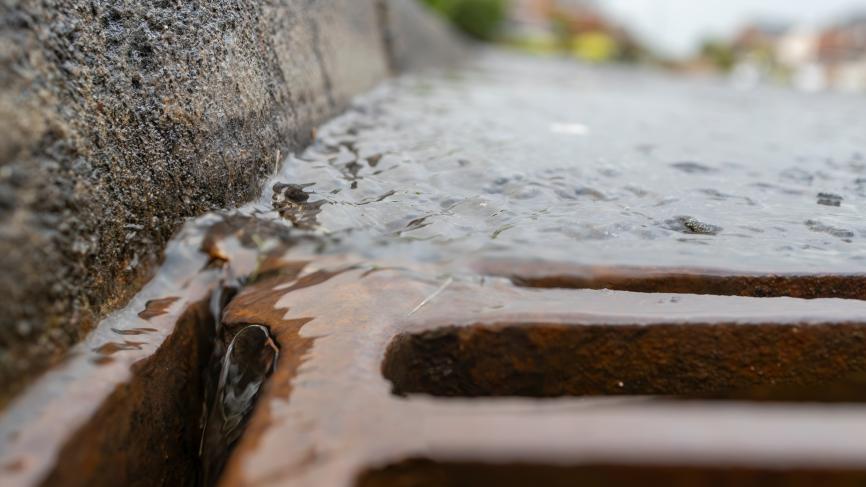 close up of water running in a catch basin