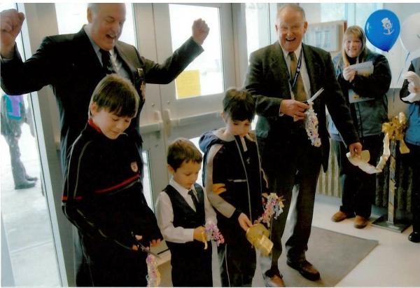 adults and kids celebrate reopening of rec centre in 2004